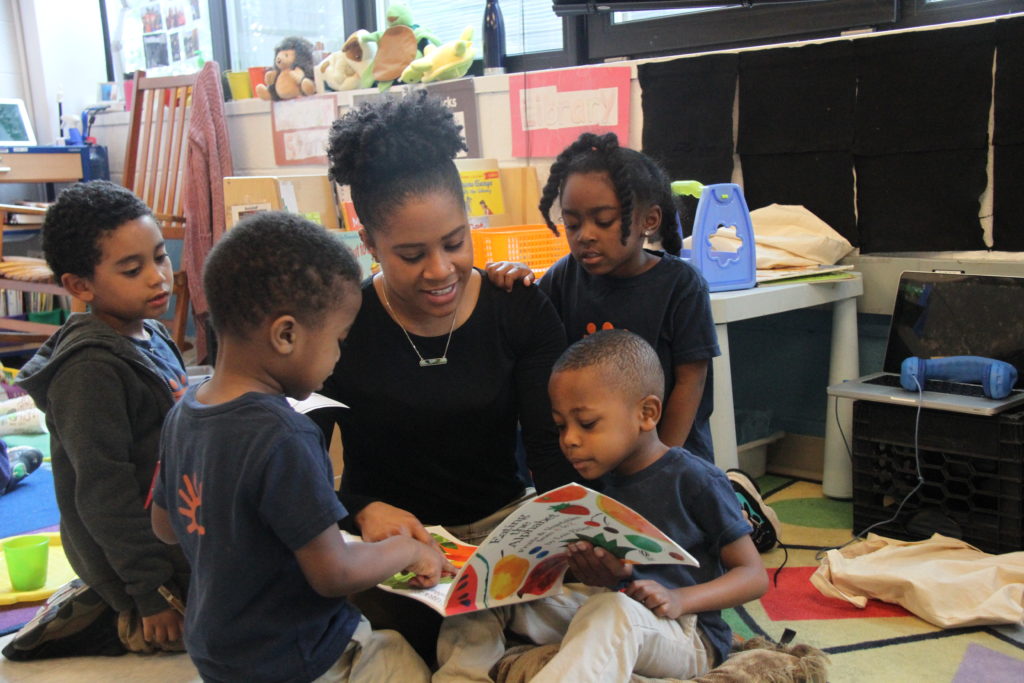 Angela Thomas reading to students