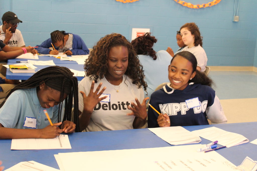 Deloitte volunteer with KIPP DC students
