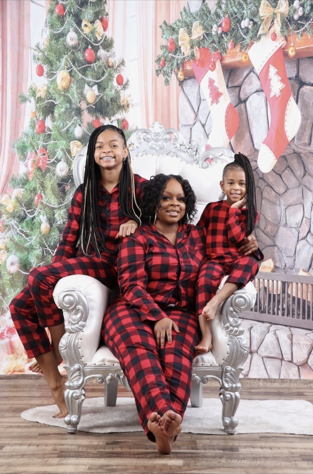 Ms. Pinkston and her daughters smiling at camera