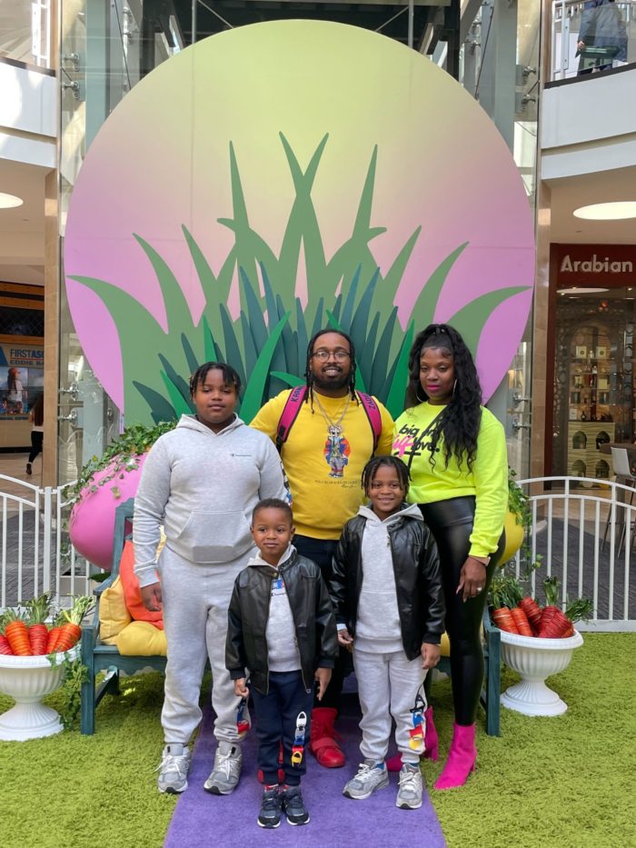 Mr. & Mrs. Jefferson with their children smiling for the camera