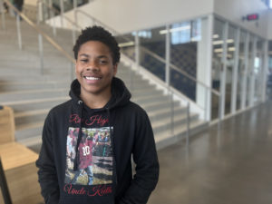 Freshman student, King, smiling into camera