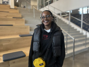 Junior student, Gabrielle, smiling into camera