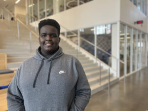 Junior student, Joel, smiling into camera