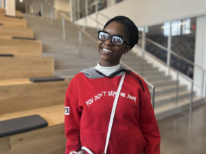 Junior student, Onesti, smiling into camera