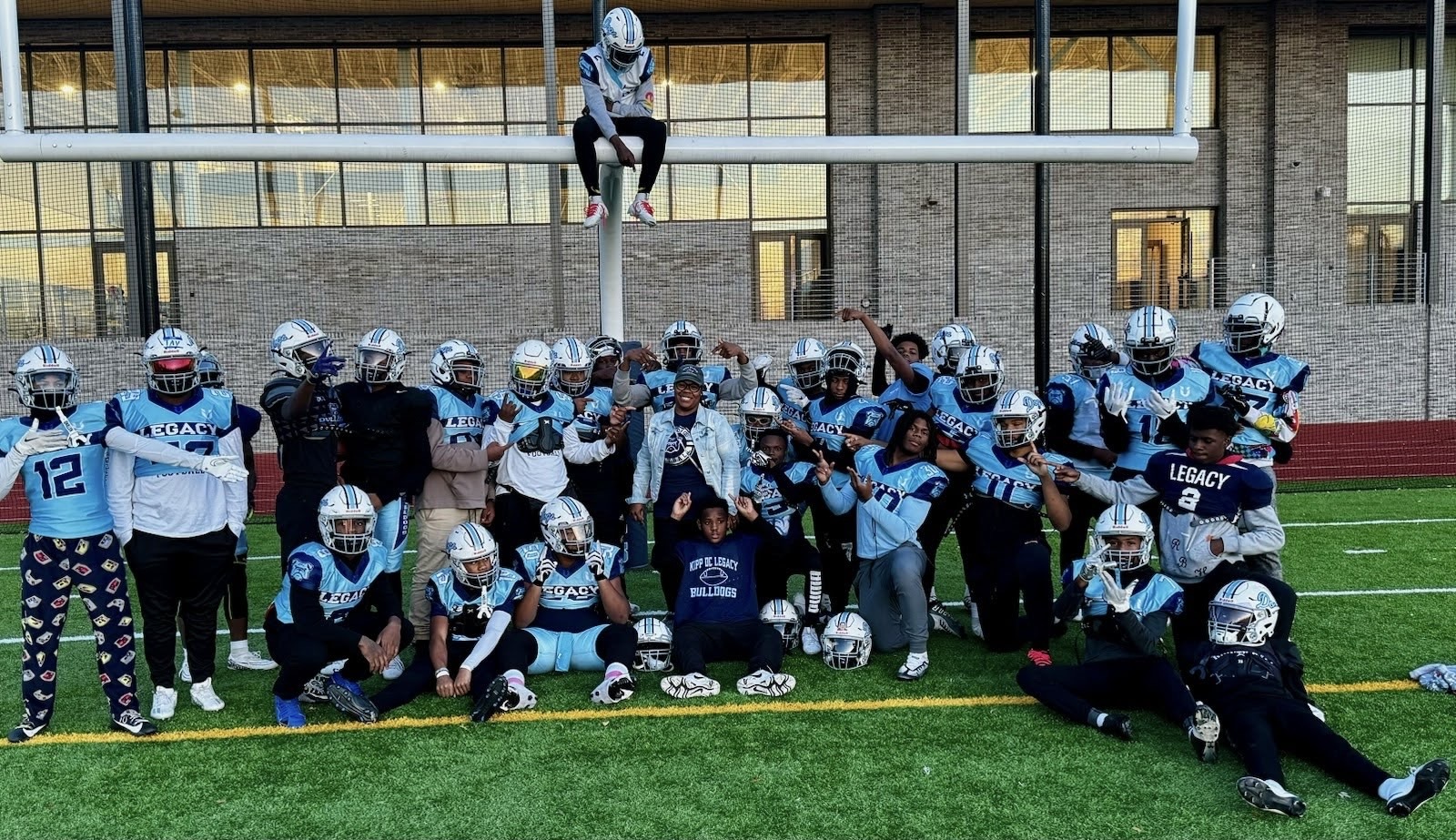 Mrs. Stubbs-Byrd with her son's football team