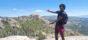 Student with mountains in the background