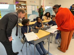 KIPP Foundation members helping students with math